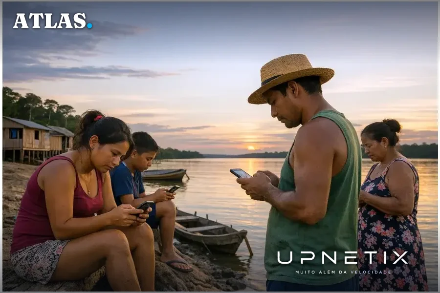 Moradores de comunidade ribeirinha amazônica usando smartphones próximos ao rio, céu aberto ao fundo.