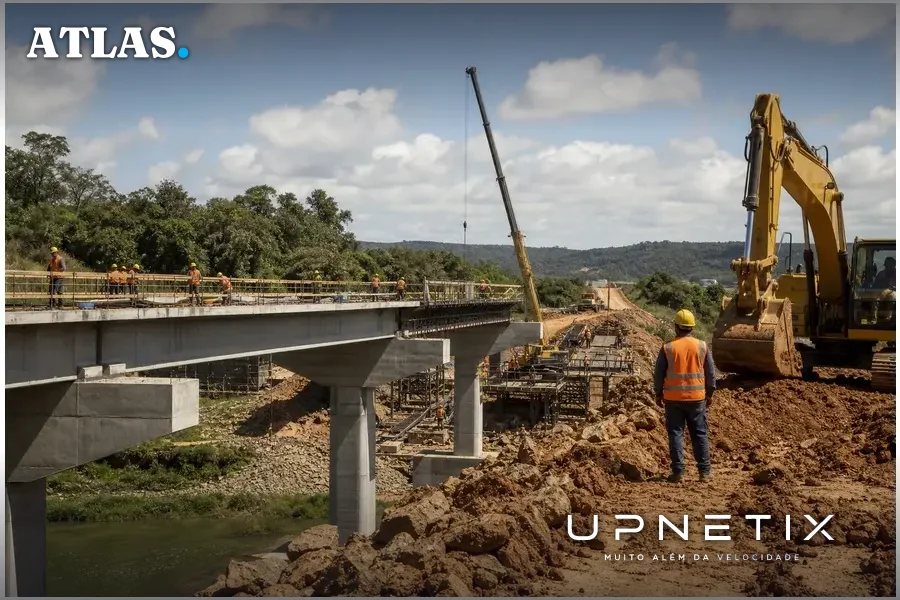 Obra de infraestrutura em construção no Brasil com operários e máquinas pesadas.